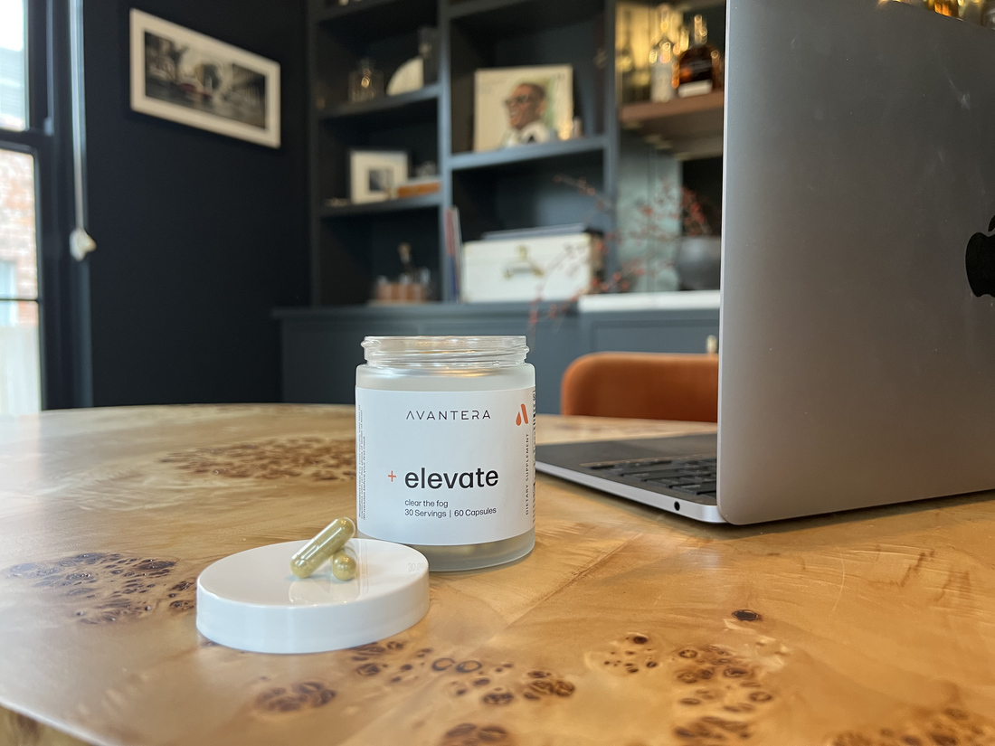 Elevate jar next to a laptop