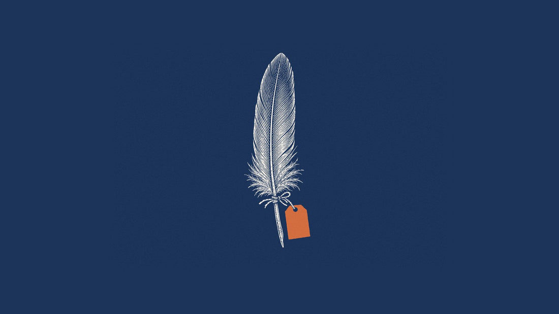 Engraving of a single feather with a blank orange tag on navy